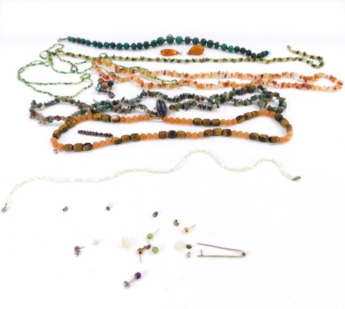 A group of beaded necklaces, comprising a malachite neck chain with yellow metal clasp stamped 9ct, orange agate necklace and various other beaded necklaces and costume jewellery. (a quantity)