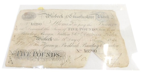 A Wisbech & Lincolnshire Bank five pound note, serial number X6280, dated 1894. (AF)