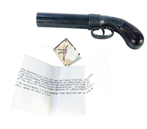 A replica antique pepper pot revolver pistol, boxed, 21cm long.