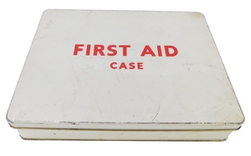 A 1960's/1970's first aid kit, with white enamel tin and contents, to include triangular bandage, lint dressing, cotton wool, etc. (a quantity)