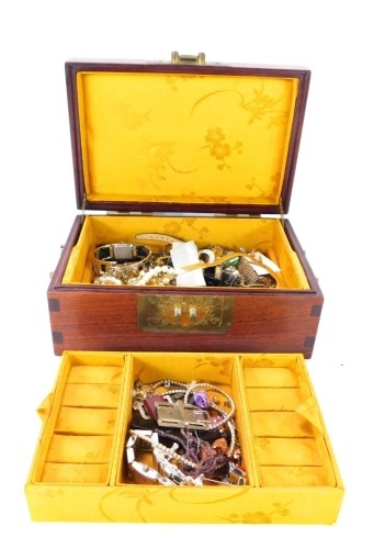 An Eastern hardwood mother of pearl inlaid jewellery box and contents, comprising belt buckles, wristwatches, bead necklaces, etc. (a quantity)
