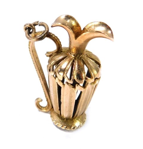 A 9ct gold urn pendant, pierced design with scroll handle, 8.5g, 3cm high.