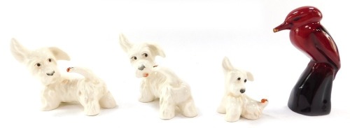 A group of figures, comprising three Beswick Scottie dogs with ladybird to tail and a Royal Doulton flambe figure of a kookaburra. (4, AF)