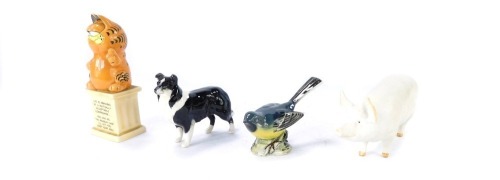 A group of figures, comprising a Beswick collie, a Garfield figure, 13cm high, a Beswick grey wagtail, 6cm high, and a Beswick pig, 6cm high. (4)