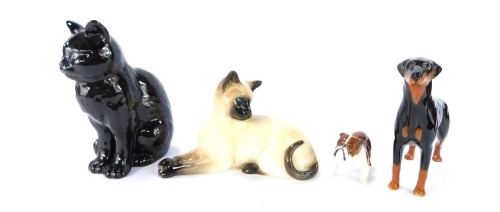 A group of Beswick ornaments, comprising Beswick Bulldog, Doberman, Siamese cat, and a Sylvac black cat. (4)