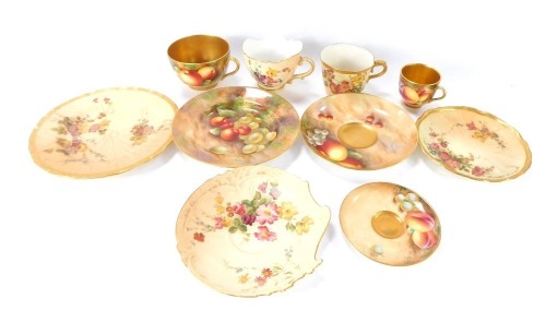 A group of Royal Worcester blush ivory wares, comprising a trio, rococo shaped cup and saucer, a coffee cup and saucer painted with fruit and berries, and a similarly decorated tea cup, saucer and plate painted by E Townsend, and Moseley. (a quantity)