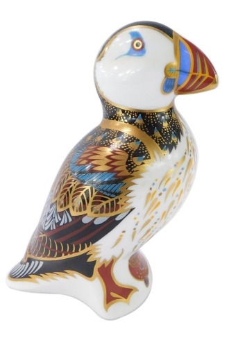 A Royal Crown Derby puffin paperweight, with gold stopper, 12cm high, boxed.