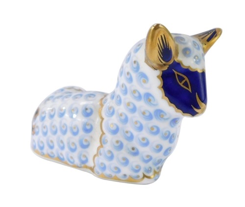 A Royal Crown Derby lamb paperweight, with gold stopper, 7cm high, boxed.