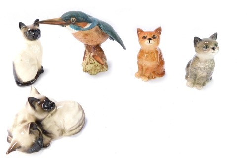 A group of Beswick animal figures, comprising a group of Siamese cats 10cm wide, a perched Siamese cat 9cm high, a grey cat 10cm high, and a ginger cat 9cm high, together with a matt kingfisher 12cm high. (5)