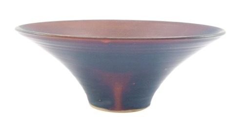 A studio pottery bowl, on a blue and purple ground with single line design and ridge type detail, unsigned, 10cm high.