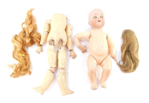 A Simon & Halbig porcelain headed and papier mache doll, various doll parts, hair, etc. (a quantity)