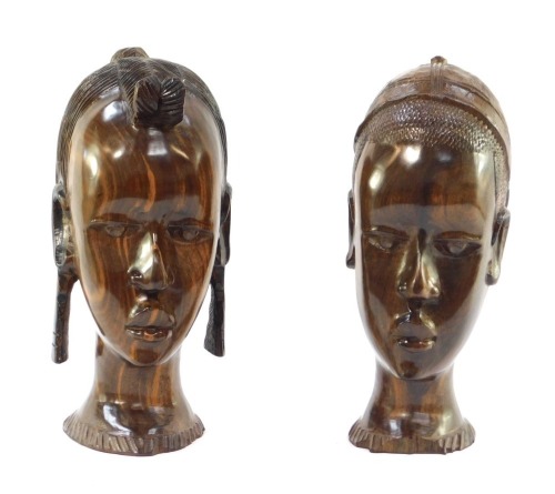 Tribal Art. Two carved busts of a lady and gentleman, 28cm high.