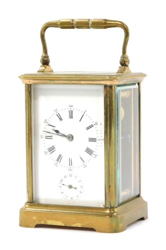 A Hards 19thC brass carriage clock, the white enamel dial bearing Roman numerals, subsidiary alarm dial, two barrel movement with bell strike, the case of conventional form, 12cm high.