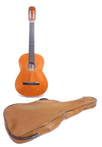 A BM Sevilla acoustic guitar, in tan carry case.