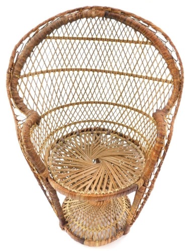 A rattan Morticia Addams peacock doll's chair, 63cm high.
