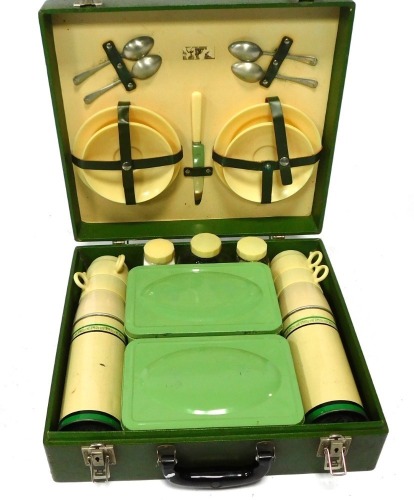 A Brexton picnic hamper, in a green case with plastic cream and green fittings, 13cm high, 40cm wide, 37cm deep.