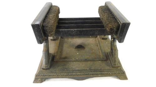 A Victorian cast iron boot scraper, with Neo Classical designed sides, 22cm high, 36cm wide, 30cm deep.