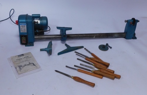 A Draper model WTL12 Spindle Speed wood lathe and accessories, and a group of turning chisels.