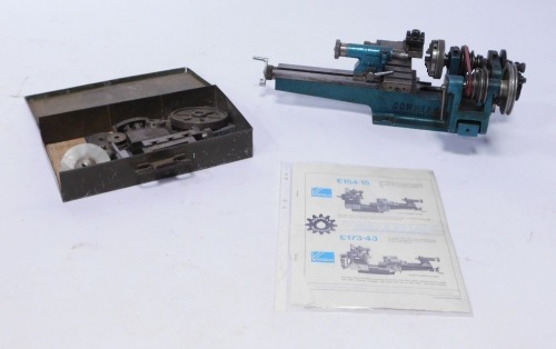 A Cowell 90 engineering or watchmaker's lathe and accessories.