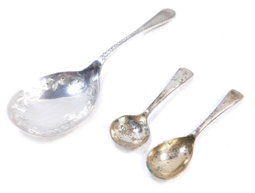 Three spoons, comprising a silver fiddle pattern spoon and two silver plated mustards, &frac34;oz gross. (3)