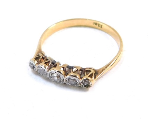 A diamond dress ring, the old cut diamonds in illusion setting, yellow metal stamped 18, size M, 1.8g all in.