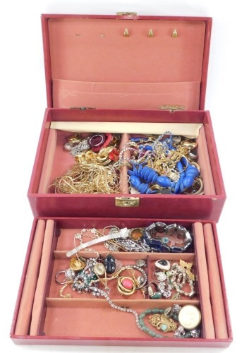 A red leatherette jewellery box and contents, comprising graduated necklace, blue beaded necklace, brooches, clip on earrings, etc. (1 box, AF)