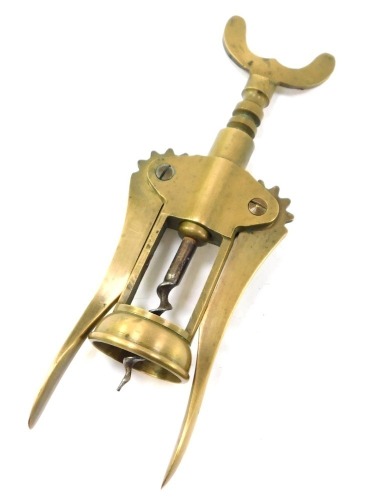 An early 20thC brass barrel corkscrew.