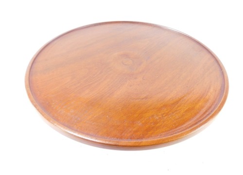 A mid to late 20thC turned mahogany lazy Susan, 35cm wide.