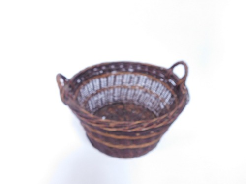 A vintage twin handle wicker log basket, 49cm diameter.