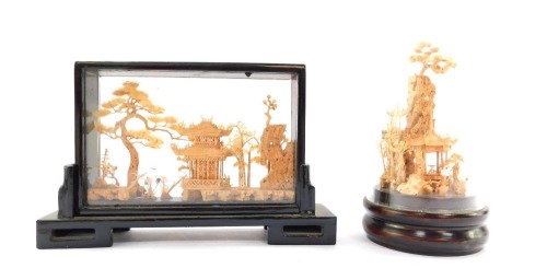 Two Chinese cork display cases, one with domed top of pagodas and buildings, 19cm high, another rectangular 14cm high. (2)