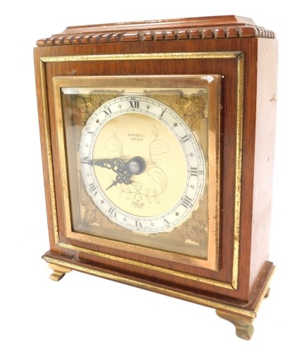 A W Mansell of Lincoln Elliott mantel clock, in a mahogany case, with brass numeric dial with a silver chapter ring, 17cm high, 51cm wide, 7cm deep.