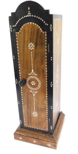 A Middle Eastern table spice cabinet, with mother of pearl inlaid and an arched top, 56cm high, 28cm wide, 18cm deep.