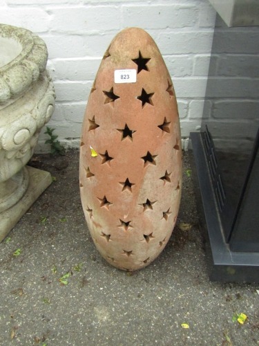 A terracotta pierced star dome garden ornament, 64cm high.