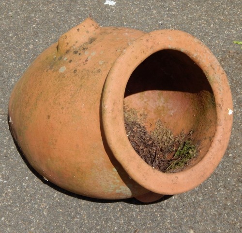 A terracotta planter shaped as an urn, 40cm high.