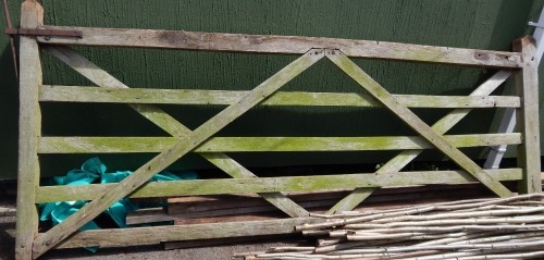 A wooden steeple five bar gate, 126cm high, 310cm wide.
