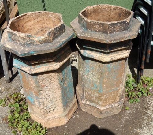 A pair of chimney pots, each with an octagonal top of turret form, each 73cm high.