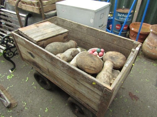 A group of vintage wooden skittles, and games, enclosed in a wooden cart (AF).