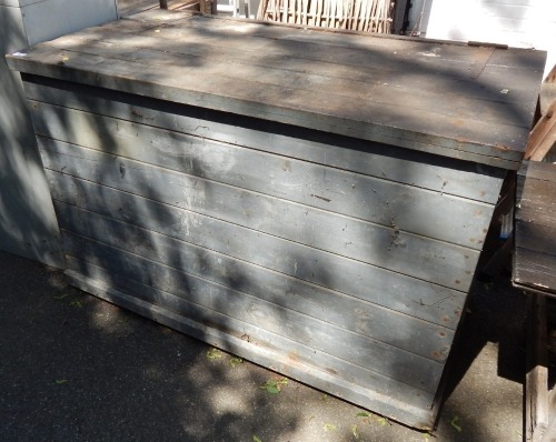 A substantial pine chest, with slatted lift up lid, on castors, painted blue, 88cm high, 133cm wide, 71cm deep. (AF)