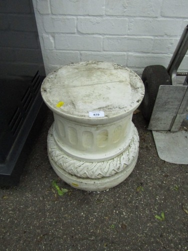 A reconstituted stone plinth, Corinthian column supports on a reeded base, 32cm high, 31cm wide.