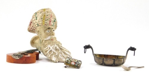 A 19thC Gambier clay pipe, modelled as Jacob, 8cm wide, together with a Scandinavian plated salt, white metal salt spoon, stamped 830S, a square micro mosaic brooch with floral and leaf decoration, and a yew miniature model of a Spanish guitar, with white