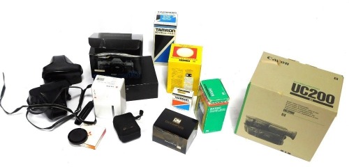 A group of cameras and accessories, comprising a Leica C1, Tamron box, two Olympus OM10 cameras, a T20 flash zoom lens, Haminex BX550, Solidor Olympus auto lens, Tamron 80x210mm lens, and a Canon UC200 camera, etc (a quantity)