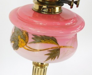 A Victorian cranberry glass oil lamp, with a cranberry glass flared shade and chimney, and a painted floral reservoir on brass column with ebonised base, 71cm high. - 2