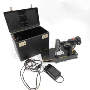 A Singer electric sewing machine, 222K, with pedal attachment and threads, boxed. (AF) WARNING! This lot contains untested or unsafe electrical items. It is supplied for scrap or re-conditioning only. TRADE ONLY - 4