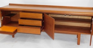 A teak sideboard, with arrangement of three cupboard doors and three drawers on H frame base, 73cm high, 208cm wide, 46cm deep. - 2