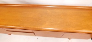 A teak sideboard, with arrangement of three cupboard doors and three drawers on H frame base, 73cm high, 208cm wide, 46cm deep. - 3