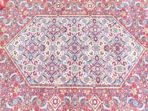An Eastern rug, on a red floral ground, 293cm x 199cm. - 2