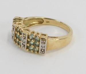 A peridot and CZ set dress ring, of three panelled design, yellow metal, stamped 9k, ring size N&frac12;, 3.8g all in. - 2