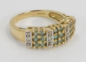A peridot and CZ set dress ring, of three panelled design, yellow metal, stamped 9k, ring size N&frac12;, 3.8g all in. - 3