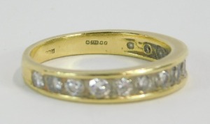 An 18ct gold diamond half hoop eternity ring, set with fourteen round brilliant cut diamonds in tension setting, each approx 0.03cts, ring size P, 4g all in. - 2