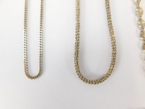A group of silver chains, to include a modern wave design silver chain, 60cm long a multi-link twist design chain, 44cm long, a Figaro type chain, 44cm long and two curb lined chains, 40cm long and 44cm long, together with a silver identity bracelet for F - 2